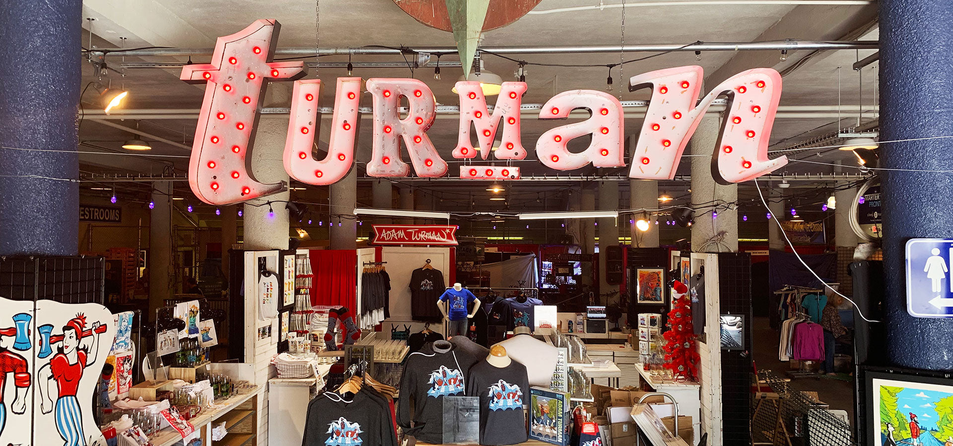 a store with a sign above it - Turman Artwork Company